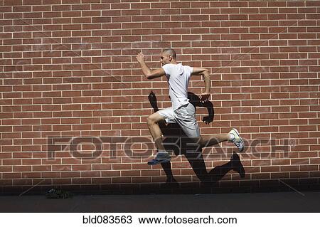 Mixed race athlete running in urban area View Large Photo Image Stock Image - Mixed race athlete running in urban area. Fotosearch