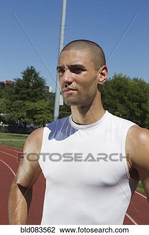 Mixed race athlete standing on track View Large Photo Image Stock Image - Mixed race athlete standing on track. Fotosearch