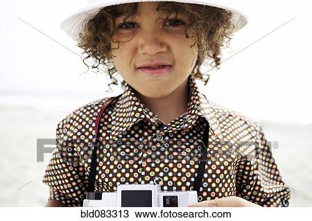 Mixed race boy using old-fashioned camera View Large Photo Image Stock Image - Mixed race boy using old-fashioned camera. Fotosearch