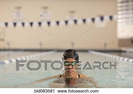 Stock Image - Pacific Islander swimmer in swimming pool. Fotosearch