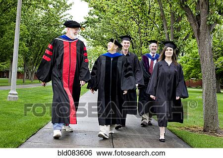 Stock Photograph - Professors and students walking to graduation. Fotosearch