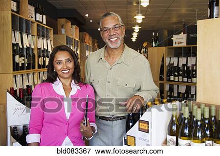 Small business owners working in wine shop View Large Photo Image Stock Photo - Small business owners working in wine shop. Fotosearch