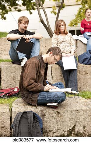 Students studying together outdoors View Large Photo Image Stock Photo - Students studying together outdoors. Fotosearch