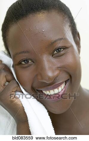 Stock Photo - Sweating African American woman. Fotosearch