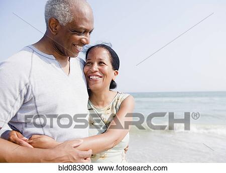 Black couple enjoying beach together View Large Photo Image Stock Photo - Black couple enjoying beach together. Fotosearch