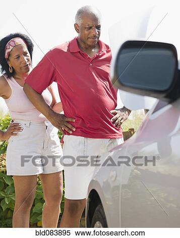 Black couple having car trouble on road trip View Large Photo Image Stock Photography - Black couple having car trouble on road trip. Fotosearch