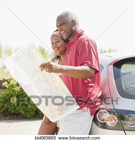 Black couple looking at road map together View Large Photo Image Stock Image - Black couple looking at road map together. Fotosearch