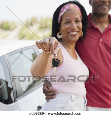 Black woman with husband holding car keys View Large Photo Image Picture - Black woman with husband holding car keys. Fotosearch