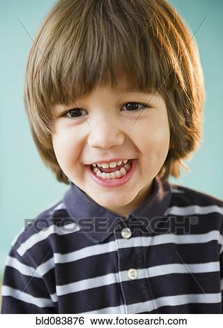 Stock Photograph - Grinning Hispanic boy. Fotosearch