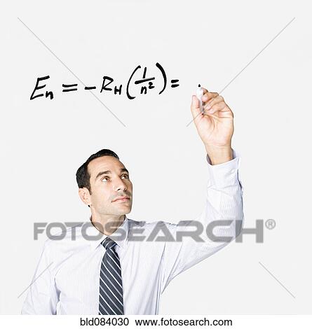 Hispanic businessman writing formula on clear board View Large Photo Image Stock Image - Hispanic businessman writing formula on clear board. Fotosearch