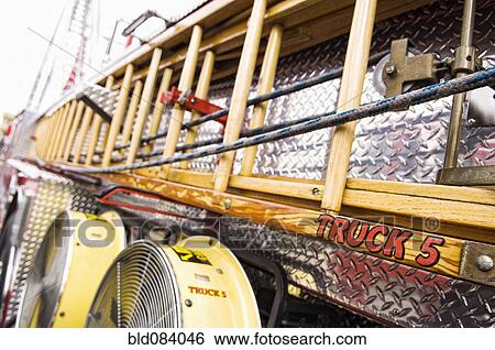 Ladder on side of fire truck View Large Photo Image Stock Photograph - Ladder on side of fire truck. Fotosearch