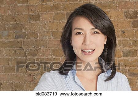 Smiling Korean woman View Large Photo Image Stock Photo - Smiling Korean woman. Fotosearch