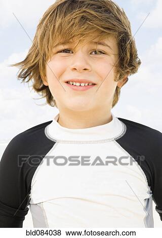 Wind blowing Caucasian boy's hair View Large Photo Image Stock Photo - Wind blowing Caucasian boy's hair. Fotosearch