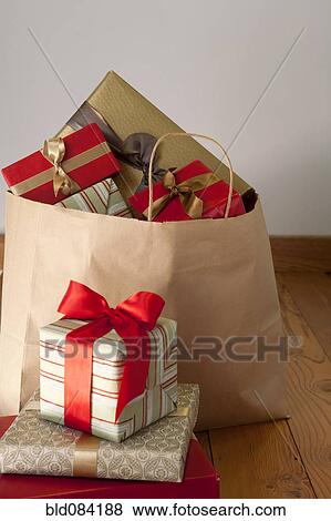 Stock Photo - Bag full of Christmas gifts. Fotosearch