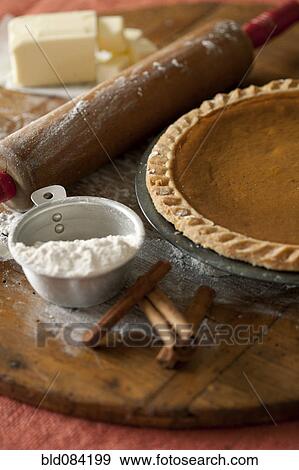 Stock Photo - Baking ingredients and homemade pumpkin pie. Fotosearch