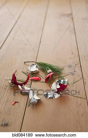 Stock Photo - Broken Christmas ornament on floor. Fotosearch