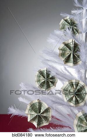 Cash ornaments on white, artificial Christmas tree View Large Photo Image Stock Image - Cash ornaments on white, artificial Christmas tree. Fotosearch