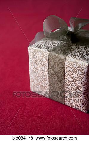 Christmas gift wrapped with bow View Large Photo Image Stock Photo - Christmas gift wrapped with bow. Fotosearch