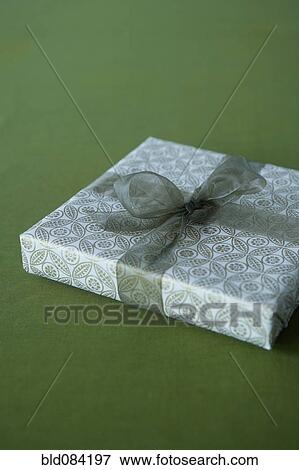 Christmas gift wrapped with bow View Large Photo Image Stock Photo - Christmas gift wrapped with bow. Fotosearch