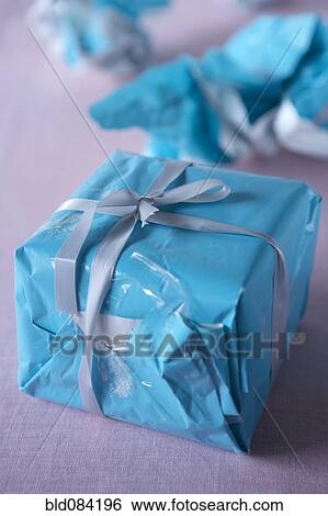 Christmas gift wrapped with wrinkled paper View Large Photo Image Stock Photograph - Christmas gift wrapped with wrinkled paper. Fotosearch