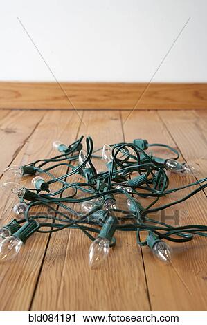 Stock Image - Christmas lights tangled on floor. Fotosearch