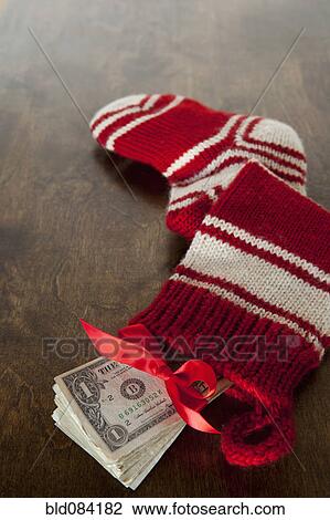 Christmas stocking full of cash View Large Photo Image Stock Image - Christmas stocking full of cash. Fotosearch