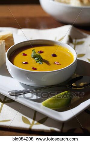 Stock Photo - Curry soup in bowl with garnish. Fotosearch
