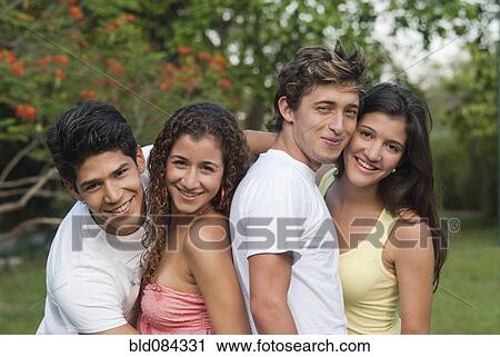 Hispanic couples hugging outdoors together View Large Photo Image Stock Image - Hispanic couples hugging outdoors together. Fotosearch