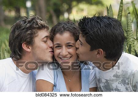 Hispanic men kissing woman View Large Photo Image Stock Photography - Hispanic men kissing woman. Fotosearch