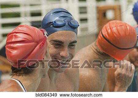 Hispanic swimmers talking together View Large Photo Image Stock Photo - Hispanic swimmers talking together. Fotosearch