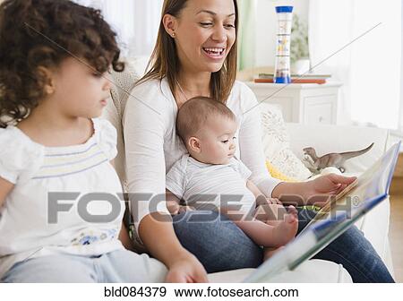 Stock Photo - Mother reading daughters storybook. Fotosearch