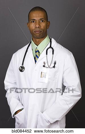 Stock Image - Serious African American doctor in lab coat. Fotosearch