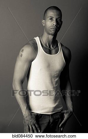 Serious African American man in tank-top View Large Photo Image Stock Image - Serious African American man in tank-top. Fotosearch