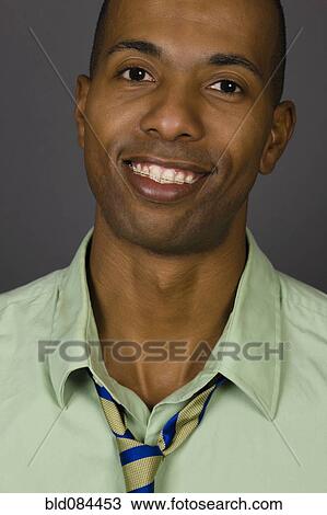 Smiling African American man wearing braces View Large Photo Image Stock Image - Smiling African American man wearing braces. Fotosearch