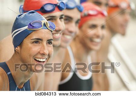 Smiling Hispanic swimmers standing in a row View Large Photo Image Stock Image - Smiling Hispanic swimmers standing in a row. Fotosearch