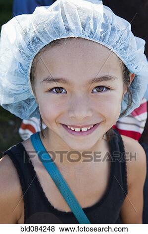 Smiling mixed race girl wearing surgical cap View Large Photo Image Stock Photo - Smiling mixed race girl wearing surgical cap. Fotosearch