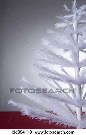 Stock Photo - White artificial Christmas tree. Fotosearch