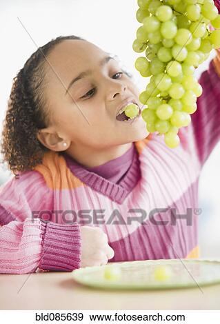 African American girl eating grapes View Large Photo Image Stock Photo - African American girl eating grapes. Fotosearch