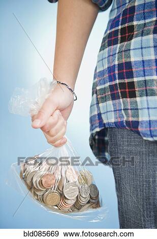 African American girl holding sack of coins View Large Photo Image Stock Photo - African American girl holding sack of coins. Fotosearch
