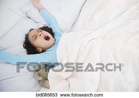 African American girl waking up in bed View Large Photo Image Stock Image - African American girl waking up in bed. Fotosearch