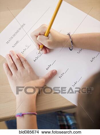 African American girl working on arithmetic homework View Large Photo Image Picture - African American girl working on arithmetic homework. Fotosearch