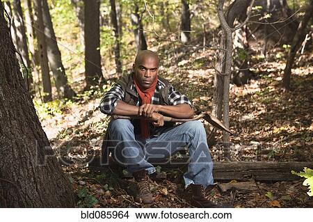 African American man sitting in woods View Large Photo Image Picture - African American man sitting in woods. Fotosearch