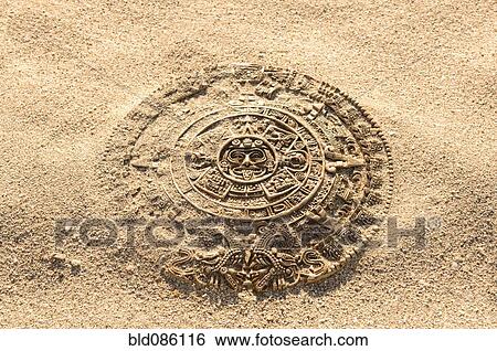 Aztec calendar stone carving on sand View Large Photo Image Stock Photograph - Aztec calendar stone carving on sand. Fotosearch
