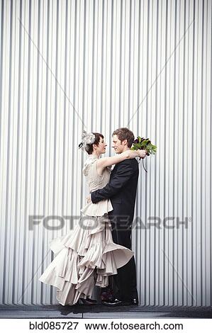 Bride and groom hugging View Large Photo Image Stock Photo - Bride and groom hugging. Fotosearch