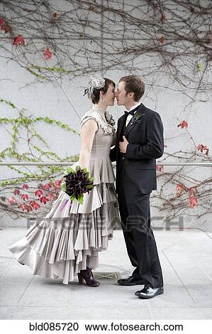 Stock Image - Bride and groom kissing. Fotosearch