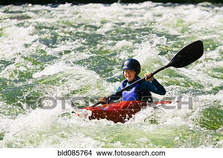 Caucasian girl kayaking in river View Large Photo Image Picture - Caucasian girl kayaking in river. Fotosearch