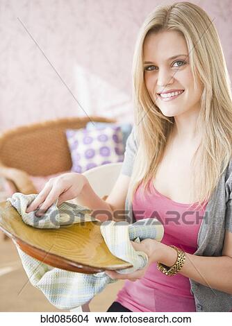 Caucasian woman drying plate View Large Photo Image Picture - Caucasian woman drying plate. Fotosearch