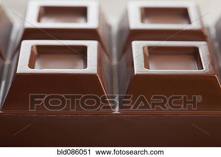 Stock Image - Close up of bar of chocolate. Fotosearch