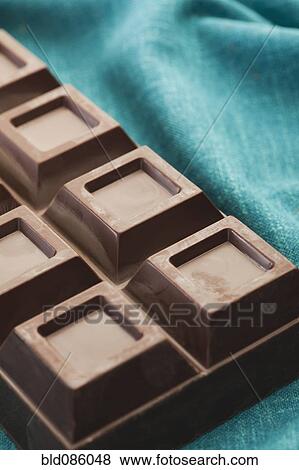 Stock Photo - Close up of bar of chocolate. Fotosearch