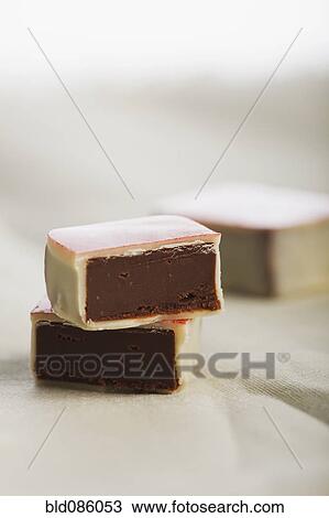 Close up of chocolate candies View Large Photo Image Stock Image - Close up of chocolate candies. Fotosearch